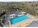 Community pool with playground and lounge chairs at 9626 Charlesberg Dr, Tampa, FL 33635