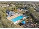 Community pool with tennis courts and clubhouse at 9626 Charlesberg Dr, Tampa, FL 33635