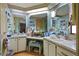 Double vanity bathroom with updated fixtures and ample storage at 9790 66Th N St # 130, Pinellas Park, FL 33782