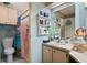 Well-lit bathroom with shower and updated vanity at 9790 66Th N St # 130, Pinellas Park, FL 33782