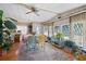 Bright dining room with wood floors and large windows at 9790 66Th N St # 130, Pinellas Park, FL 33782