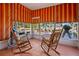 Relaxing sunroom with rocking chairs and view of the backyard at 9790 66Th N St # 130, Pinellas Park, FL 33782