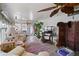 Sunroom with tiled floor, ceiling fan, and ample natural light at 9790 66Th N St # 130, Pinellas Park, FL 33782