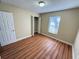 Spacious bedroom with wood-look floors and a closet at 21026 Voyager Blvd # 6, Land O Lakes, FL 34638