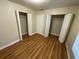 Simple bedroom with laminate flooring and double closets at 21026 Voyager Blvd # 6, Land O Lakes, FL 34638