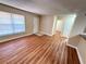 Bright living room with wood-look floors and access to other rooms at 21026 Voyager Blvd # 6, Land O Lakes, FL 34638