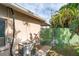 Rear exterior view of the home showcasing the AC unit and a side yard with a gate at 1004 Orlando Ave, Bradenton, FL 34207
