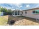 Backyard with grassy area, fire pit, and detached shed at 1004 Orlando Ave, Bradenton, FL 34207