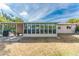 Home exterior showcasing a covered patio and fenced backyard at 1004 Orlando Ave, Bradenton, FL 34207