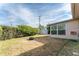 Backyard view showcasing shed, grassy area and fire pit at 1004 Orlando Ave, Bradenton, FL 34207
