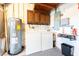 Laundry area with washer, dryer, and ample storage cabinets at 1004 Orlando Ave, Bradenton, FL 34207