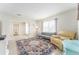 Bright living room features comfortable seating and a large area rug at 1004 Orlando Ave, Bradenton, FL 34207