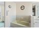 Clean bathroom with a bathtub, single sink, and decorative wall art at 10079 Cara St, Spring Hill, FL 34608