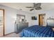 Bright bedroom featuring a dresser, TV, and large window at 10079 Cara St, Spring Hill, FL 34608