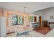 Casual dining area with adjacent wet bar and view to backyard at 10079 Cara St, Spring Hill, FL 34608