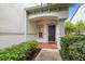 Front entrance with walkway, landscaping, and a dark-colored door at 1009 Bella Vista Ne Dr, St Petersburg, FL 33702