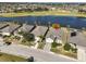 Aerial view of house and community, showcasing location by the lake at 1031 Emerald Dunes Dr, Sun City Center, FL 33573