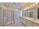 Bathroom boasts double sinks and a walk-in shower at 1031 Emerald Dunes Dr, Sun City Center, FL 33573