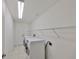 Laundry room with washer, dryer, and ample shelving at 1031 Emerald Dunes Dr, Sun City Center, FL 33573