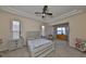 Main bedroom with large windows and wood-toned furniture at 1031 Emerald Dunes Dr, Sun City Center, FL 33573