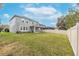 Large backyard with grassy area and privacy fence at 10409 Waterstone Dr, Riverview, FL 33578
