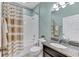 Bathroom with granite countertop, shower/tub combo and striped shower curtain at 10409 Waterstone Dr, Riverview, FL 33578