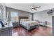 Spacious Primary bedroom with wood floors and large windows at 10409 Waterstone Dr, Riverview, FL 33578