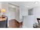 Upstairs hallway with hardwood floors and double door closets at 10409 Waterstone Dr, Riverview, FL 33578