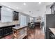 Kitchen boasts dark cabinetry, stainless steel appliances, and an island with butcher block top at 10409 Waterstone Dr, Riverview, FL 33578