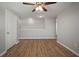 Spacious bedroom with ceiling fan and wood-look flooring at 10637 Park Meadowbrooke Dr, Riverview, FL 33578