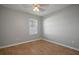 Bright bedroom with wood-look floors and a window at 10637 Park Meadowbrooke Dr, Riverview, FL 33578