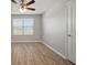 Bright bedroom featuring wood-look floors and window coverings at 10637 Park Meadowbrooke Dr, Riverview, FL 33578