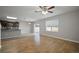 Open living room with hardwood floors and access to the kitchen at 10637 Park Meadowbrooke Dr, Riverview, FL 33578