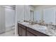 Bathroom with double vanity and granite countertop at 10825 Patoka Ter, Parrish, FL 34219