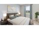 Cozy bedroom with a queen-size bed and neutral color scheme at 10825 Patoka Ter, Parrish, FL 34219