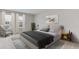 Bright bedroom with a king-size bed and an armchair at 10825 Patoka Ter, Parrish, FL 34219
