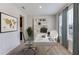 Bright home office features a desk, chairs, and built-in shelving at 10825 Patoka Ter, Parrish, FL 34219