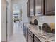 Walk-in pantry with granite countertops and ample storage at 10825 Patoka Ter, Parrish, FL 34219