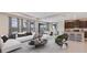 Open living space with L-shaped sofa and access to the backyard at 10825 Patoka Ter, Parrish, FL 34219