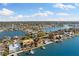 Bird's-eye view of waterfront community with many homes and waterways at 110 Driftwood Ln, Largo, FL 33770