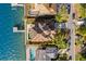 High-angle view of waterfront home with pool and private dock at 110 Driftwood Ln, Largo, FL 33770