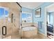 Spa-like bathroom with soaking tub and walk-in shower at 110 Driftwood Ln, Largo, FL 33770