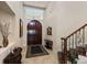 Grand entryway with double doors, a staircase, and tiled flooring at 110 Driftwood Ln, Largo, FL 33770