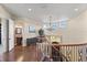 Upper hallway with hardwood floors and chandelier overlooking the entryway at 110 Driftwood Ln, Largo, FL 33770