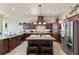 Spacious kitchen with an island, stainless steel appliances, and granite countertops at 110 Driftwood Ln, Largo, FL 33770
