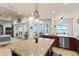 Kitchen with granite island, water views, and stainless steel appliances at 110 Driftwood Ln, Largo, FL 33770
