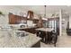 Spacious kitchen featuring granite countertops, stainless steel appliances, and ample cabinetry at 110 Driftwood Ln, Largo, FL 33770