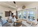 Living room with water views, comfortable seating, and an open floor plan at 110 Driftwood Ln, Largo, FL 33770