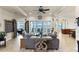 Spacious living room with water views and access to a large balcony at 110 Driftwood Ln, Largo, FL 33770