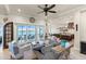 Open floor plan living room, kitchen, and dining area with water views at 110 Driftwood Ln, Largo, FL 33770